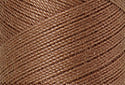 A swatch of Mettler Silk Finish 50 Thread Walnut 0280