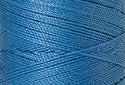 A swatch of Mettler Silk Finish 50 Thread Reef Blue 0338