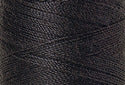 A swatch of Mettler Silk Finish 50 Thread Mole Gray 0348