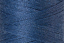 A swatch of Mettler Silk Finish 50 Thread Smoky Blue 0351