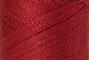 A swatch of Mettler Silk Finish 50 Thread Country Red 0504