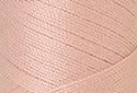 A swatch of Mettler Silk Finish 50 Thread Flesh 0600