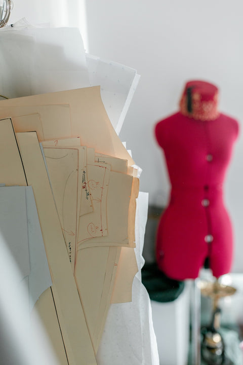 Sewing patterns and a red mannequin