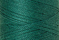 A swatch of Mettler Silk Finish 50 Thread Green 0222