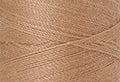 A swatch of Mettler Silk Finish 50 Thread Oat Straw 0260