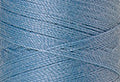 A swatch of Mettler Silk Finish 50 Thread Azure Blue 0272