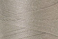 A swatch of Mettler Silk Finish 50 Thread Fieldstone 0412