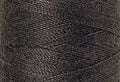 A swatch of Mettler Silk Finish 50 Thread Dark Charcoal 0416