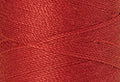 A swatch of Mettler Silk Finish 50 Thread Wildfire 0501