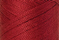 A swatch of Mettler Silk Finish 50 Thread Country Red 0504