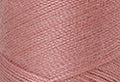 A swatch of Mettler Silk Finish 50 Thread Antique Pink 0637
