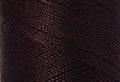 A swatch of Mettler Silk Finish 50 Thread Mahogany 0793
