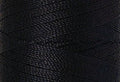 A swatch of Mettler Silk Finish 50 Thread Darkest Blue 0821