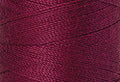 A swatch of Mettler Silk Finish 50 Thread Pomegranate 0869