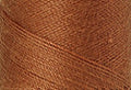 A swatch of Mettler Silk Finish 50 Thread Bronze 0899