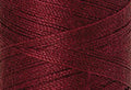 A swatch of Mettler Silk Finish 50 Thread Cranberry 0918