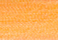 A swatch of Mettler Silk Finish 50 Thread Warm Apricot 1171