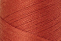 A swatch of Mettler Silk Finish 50 Thread Reddish Ocher 1288