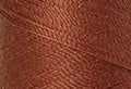 A swatch of Mettler Silk Finish 50 Thread Dirty Penny 1347