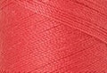 A swatch of Mettler Silk Finish 50 Thread Persimmon 1402