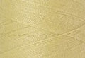 A swatch of Mettler Silk Finish 50 Thread Lemon Frost 1412