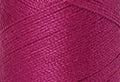 A swatch of Mettler Silk Finish 50 Thread Peony 1417
