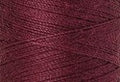 A swatch of Mettler Silk Finish 50 Thread Claret 1461