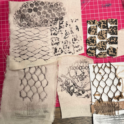 Collection of textured fabric samples on a cutting mat at TMS