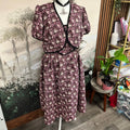 Purple floral co-ord set on a mannequin in a room with plants and furniture. made at TMS