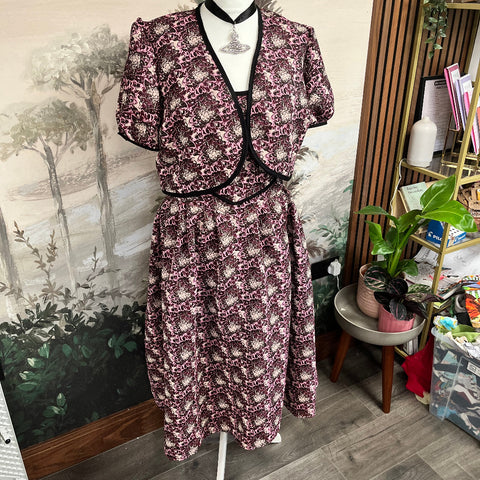 Purple floral co-ord set on a mannequin in a room with plants and furniture. made at TMS