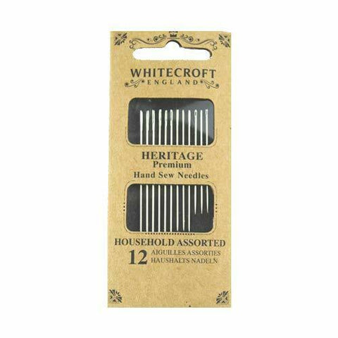 Packaging for Whitecroft England Heritage Premium hand sew needles, showing a cardboard dispenser with needles visible inside.